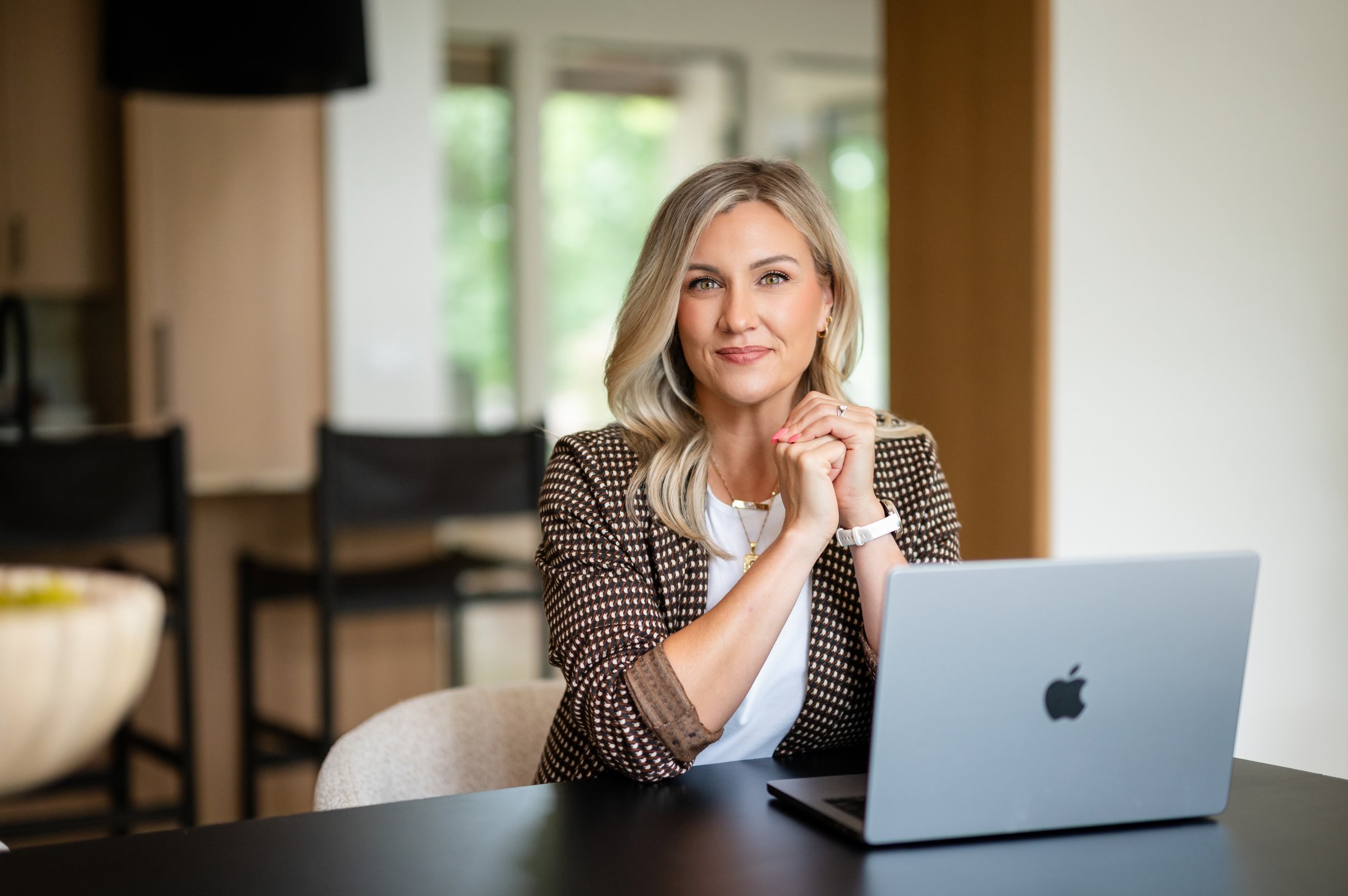 Crystal Stephens, Nashville real estate agent with Compass, working at her laptop